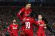 LIVERPOOL, ENGLAND - OCTOBER 02: Sadio Mane of Liverpool celebrates with Roberto Firmino after scoring his sides first goal during the UEFA Champions League group E match between Liverpool FC and RB Salzburg at Anfield on October 02, 2019 in Liverpool, United Kingdom. (Photo by Clive Brunskill/Getty Images)