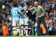 MANCHESTER, ENGLAND - OCTOBER 06: Pep Guardiola, Manager of Manchester City gives instructions as Fernandinho of Manchester City is given the captains armband during the Premier League match between Manchester City and Wolverhampton Wanderers at Etihad Stadium on October 06, 2019 in Manchester, United Kingdom. (Photo by Clive Brunskill/Getty Images)