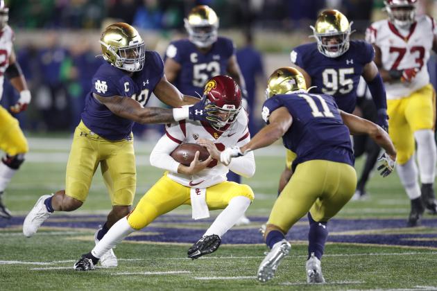 SOUTH BEND, IN - OCTOBER 12: Julian Okwara #42 and Alohi Gilman #11 of the Notre Dame Fighting Irish converge on Kedon Slovis #9 of the USC Trojans in the first half of the game at Notre Dame Stadium on October 12, 2019 in South Bend, Indiana. (Photo by Joe Robbins/Getty Images)
