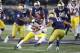 SOUTH BEND, IN - OCTOBER 12: Julian Okwara #42 and Alohi Gilman #11 of the Notre Dame Fighting Irish converge on Kedon Slovis #9 of the USC Trojans in the first half of the game at Notre Dame Stadium on October 12, 2019 in South Bend, Indiana. (Photo by Joe Robbins/Getty Images)