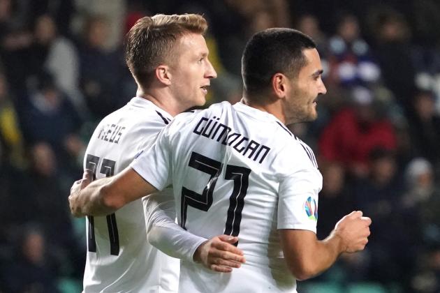 Germany's midfielder Ilkay Gundogan (R) celebrates scoring with Germany's forward Marco Reus during the Euro 2020 qualifier Group C Estonia v Germany in Tallinn, Estonia, on October 13, 2019. (Photo by JANEK SKARZYNSKI / AFP) (Photo by JANEK SKARZYNSKI/AFP via Getty Images)