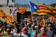 Protesters walk on the AP-7 highway near Girona, on October 16, 2019, a day after police arrested 51 people across Catalonia overnight after violent protests over the jailing of nine separatist leaders for their role in a failed 2017 independence bid. (Photo by Pau Barrena / AFP) (Photo by PAU BARRENA/AFP via Getty Images)