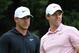 ATLANTA, GEORGIA - AUGUST 25: Brooks Koepka of the United States and Rory McIlroy of Northern Ireland look on from the eighth tee during the final round of the TOUR Championship at East Lake Golf Club on August 25, 2019 in Atlanta, Georgia. (Photo by Streeter Lecka/Getty Images)