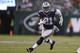 Dallas Cowboys running back Ezekiel Elliott (21) runs up the field with the ball during the second half of an NFL football game against the New York Jets, Sunday, Oct. 13, 2019, in East Rutherford, N.J. (AP Photo/Steve Luciano)