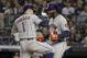 Houston Astros' Carlos Correa (1) celebrates with designated hitter Yordan Alvarez (44) after hitting a three-run home run against the New York Yankees during the sixth inning of Game 4 of baseball's American League Championship Series, Thursday, Oct. 17, 2019, in New York. (AP Photo/Frank Franklin II)