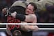 FILE - In this March 29, 2015, file photo, Bray Wyatt is upended by his opponent, The Undertaker, at Wrestlemania XXXI in Santa Clara, Calif. The WWE is set for its annual sports entertainment extravaganza Sunday, April 1, 2017, in Orlando, Fla. John Cena, the Undertaker, the Miz and the Bella Twins all have big matches on the show. (AP Photo/Don Feria, File)