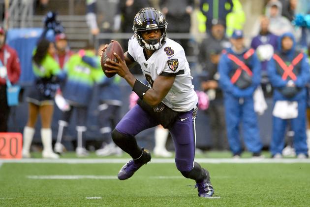 SEATTLE, WASHINGTON - OCTOBER 20: Lamar Jackson #8 of the Baltimore Ravens rolls out of the pocket during the first half of the game against the Seattle Seahawks at CenturyLink Field on October 20, 2019 in Seattle, Washington. (Photo by Alika Jenner/Getty Images)