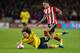 SHEFFIELD, ENGLAND - OCTOBER 21: Matteo Guendouzi of Arsenal gets fouled by Billy Sharp of Sheffield United during the Premier League match between Sheffield United and Arsenal FC at Bramall Lane on October 21, 2019 in Sheffield, United Kingdom. (Photo by James Williamson - AMA/Getty Images)