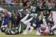 New England Patriots middle linebacker Kyle Van Noy (53) recovers the ball fumbled by New York Jets quarterback Sam Darnold, left, after Darnold was sacked during the first half of an NFL football game Monday, Oct. 21, 2019, in East Rutherford, N.J. (AP Photo/Adam Hunger)