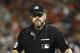 Umpire Rob Drake stands on the field in the x inning of a baseball game between the Atlanta Braves and the Washington Nationals, Friday, Sept. 13, 2019, in Washington. (AP Photo/Patrick Semansky)