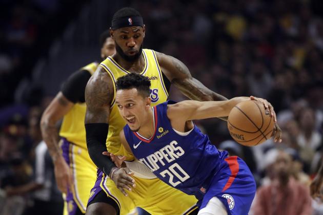 Los Angeles Clippers' Landry Shamet (20) is defended by Los Angeles Lakers' LeBron James during the first half of an NBA basketball game Tuesday, Oct. 22, 2019, in Los Angeles. (AP Photo/Marcio Jose Sanchez)