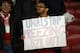 LONDON, ENGLAND - OCTOBER 24: A fan holds a sign regarding Unai Emery and Mesut Ozil during the UEFA Europa League group F match between Arsenal FC and Vitoria Guimaraes at Emirates Stadium on October 24, 2019 in London, United Kingdom. (Photo by Bryn Lennon/Getty Images)