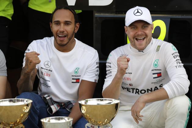 Mercedes driver Lewis Hamilton of Britain, left, winner, celebrates with his teammate Valtteri Bottas of Finland, second placed, after the Russian Formula one Grand Prix, at the 'Sochi Autodrom' Formula One circuit, in Sochi, Russia, Sunday, Sept.29, 2019. (AP Photo/Luca Bruno)