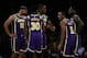 Los Angeles Lakers forward Jared Dudley (10) huddles, from left to right, with forward Troy Daniels (30), center Dwight Howard (39), guard Avery Bradley (11) and forward LeBron James (23) during the first half of an NBA basketball game in Los Angeles, Friday, Oct. 25, 2019. (AP Photo/Alex Gallardo)