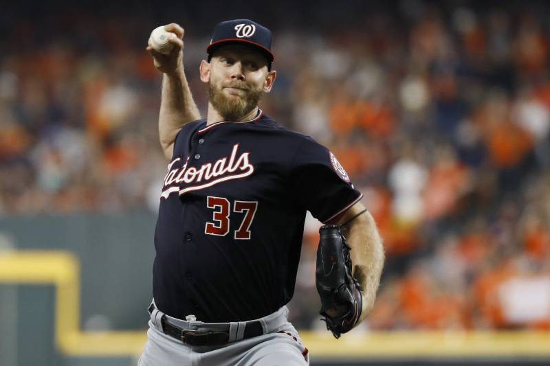 Washington Nationals starting pitcher Stephen Strasburg throws against the Houston Astros during the first inning of Game 2 of the baseball World Series Wednesday, Oct. 23, 2019, in Houston. (AP Photo/Matt Slocum)