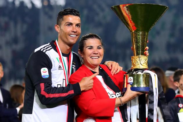 TURIN, ITALY - MAY 19: Cristiano Ronaldo of Juventus poses with the Serie A trophy alongside his mother Maria Dolores dos Santos Aveiro following the Serie A match between Juventus and Atalanta BC at Allianz Stadium on May 19, 2019 in Turin, Italy. (Photo by Chris Brunskill/Fantasista/Getty Images)