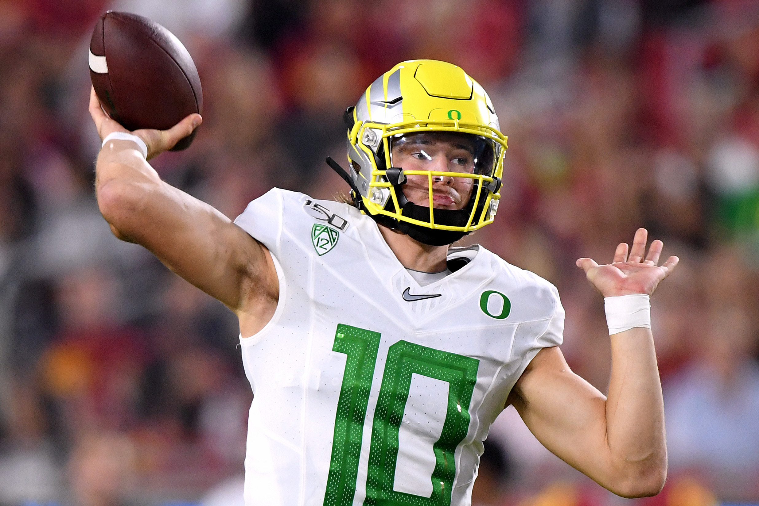 Justin Herbert of the Oregon Ducks passes the ball against the