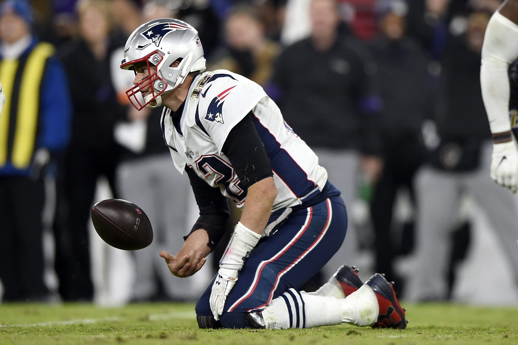 New England Patriots quarterback Tom Brady is sacked for a loss by