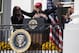 First lady Melania Trump laughs as President Donald Trump hugs Washington Nationals catcher Kurt Suzuki during an event to honor the 2019 World Series Champion, Washington Nationals, at the White House, Monday, Nov. 4, 2019, in Washington. (AP Photo/ Evan Vucci)