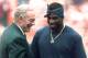 Dallas Cowboys owner Jerry Jones talks with his newest acquisition, Deion Sanders, on the sidelines before the start of the Cowboys game against the Washington Redskins at RFK Stadium in Washington Sunday, Oct. 1, 1995. Sanders, who underwent ankle surgery earlier this week, hopes to be in uniform in two weeks. (AP Photo/Doug Mills)