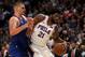 DENVER, COLORADO - NOVEMBER 08: Nikola Jokic #15 of the Denver Nuggets guards Joel Embiid #21 of the Philadelphia 76ers in the fourth quarter at the Pepsi Center on November 08, 2019 in Denver, Colorado. NOTE TO USER: User expressly acknowledges and agrees that, by downloading and or using this photograph, User is consenting to the terms and conditions of the Getty Images License Agreement. (Photo by Matthew Stockman/Getty Images)