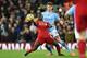 Liverpool's Senegalese striker Sadio Mane (L) vies with Manchester City's English defender John Stones during the English Premier League football match between Liverpool and Manchester City at Anfield in Liverpool, north west England on November 10, 2019. (Photo by Paul ELLIS / AFP) / RESTRICTED TO EDITORIAL USE. No use with unauthorized audio, video, data, fixture lists, club/league logos or 'live' services. Online in-match use limited to 120 images. An additional 40 images may be used in extra time. No video emulation. Social media in-match use limited to 120 images. An additional 40 images may be used in extra time. No use in betting publications, games or single club/league/player publications. / (Photo by PAUL ELLIS/AFP via Getty Images)