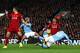 LIVERPOOL, ENGLAND - NOVEMBER 10: Bernardo Silva of Manchester City and Trent Alexander-Arnold of Liverpool handle the ball during the Premier League match between Liverpool FC and Manchester City at Anfield on November 10, 2019 in Liverpool, United Kingdom. (Photo by Chloe Knott - Danehouse/Getty Images)
