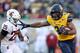 BERKELEY, CALIFORNIA - NOVEMBER 09: Christopher Brown Jr. #34 of the California Golden Bears gets away from Skyler Thomas #25 of the Washington State Cougars to run in for a touchdown at California Memorial Stadium on November 09, 2019 in Berkeley, California. (Photo by Ezra Shaw/Getty Images)