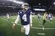 Dallas Cowboys quarterback Dak Prescott walks off the field following the game between the Dallas Cowboys and Minnesota Vikings in an NFL football game in Arlington, Texas, Sunday, Nov. 10, 2019. (AP Photo/Ron Jenkins)