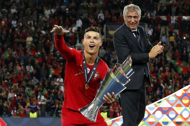(L-R) Cristiano Ronaldo of Portugal with the Nations League trophy, coach Fernando Santos of Portugal during the UEFA Nations League final match between Portugal and The Netherlands at Estadio do Dragao on June 09, 2019 in Porto, Portugal(Photo by VI Images via Getty Images)