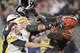 Cleveland Browns defensive end Myles Garrett (95) hits Pittsburgh Steelers quarterback Mason Rudolph (2) with a helmet during the second half of an NFL football game Thursday, Nov. 14, 2019, in Cleveland. (AP Photo/David Richard)
