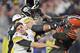 Cleveland Browns defensive end Myles Garrett (95) hits Pittsburgh Steelers quarterback Mason Rudolph (2) with a helmet during the second half of an NFL football game Thursday, Nov. 14, 2019, in Cleveland. (AP Photo/David Richard)