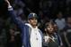 Former NBA player Carmelo Anthony gestures as he and Houston Rockets guard Chris Paul watch Miami Heat guard Dwyane Wade during the second half of an NBA basketball game, Wednesday, April 10, 2019, in New York. (AP Photo/Kathy Willens)