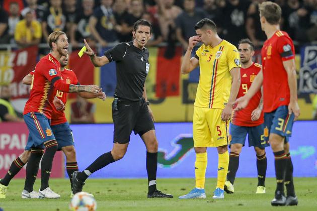 Spain's Sergio Ramos, left reacts after being yellow carded during the Euro 2020 group F qualifying soccer match between Romania and Spain, at the National Arena stadium in Bucharest, Romania, Thursday, Sept. 5, 2019. (AP Photo/Vadim Ghirda)