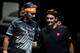 Greece's Stefanos Tsitsipas (L) and Switzerland's Roger Federer interact before the men's singles semi-final match on day seven of the ATP World Tour Finals tennis tournament at the O2 Arena in London on November 16, 2019. (Photo by Daniel LEAL-OLIVAS / AFP) (Photo by DANIEL LEAL-OLIVAS/AFP via Getty Images)