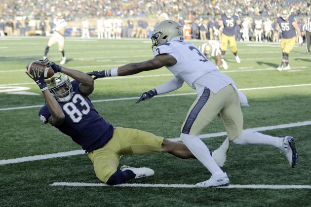 Notre Dame wide receiver Chase Claypool (83) makes a touchdown reception against Navy cornerback Cameron Kinley (3) during the first half of an NCAA college football game, Saturday, Nov. 16, 2019, in South Bend, Ind.(AP Photo/Darron Cummings)