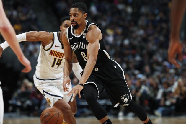 Brooklyn Nets guard Spencer Dinwiddie drives past Denver Nuggets guard Gary Harris during the second half of an NBA basketball game Thursday, Nov. 14, 2019 in Denver. The Nuggets won 101-93. (AP Photo/David Zalubowski)