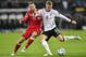 Germany's Toni Kroos, right, and Belarus' Igor Stasevich challenge for the ball during the Euro 2020 group C qualifying soccer match between Germany and Belarus in Moenchengladbach, Germany, Saturday, Nov. 16, 2019. (AP Photo/Martin Meissner)