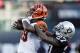 Cincinnati Bengals wide receiver Auden Tate is stopped with the ball by Oakland Raiders cornerback Trayvon Mullen (27) during the second half of an NFL football game in Oakland, Calif., Sunday, Nov. 17, 2019. (AP Photo/D. Ross Cameron)
