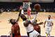 Los Angeles Lakers' LeBron James (23) shoots under pressure from Atlanta Hawks' DeAndre' Bembry during the first half of an NBA basketball game, Sunday, Nov. 17, 2019, in Los Angeles. (AP Photo/Ringo H.W. Chiu)