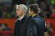 Manchester United's Portuguese manager Jose Mourinho (L) shakes hands with Tottenham Hotspur's Argentinian head coach Mauricio Pochettino (R) on the touchline towards the end of the English Premier League football match between Manchester United and Tottenham Hotspur at Old Trafford in Manchester, north west England, on August 27, 2018. (Photo by Oli SCARFF / AFP) / RESTRICTED TO EDITORIAL USE. No use with unauthorized audio, video, data, fixture lists, club/league logos or 'live' services. Online in-match use limited to 120 images. An additional 40 images may be used in extra time. No video emulation. Social media in-match use limited to 120 images. An additional 40 images may be used in extra time. No use in betting publications, games or single club/league/player publications. / (Photo credit should read OLI SCARFF/AFP via Getty Images)