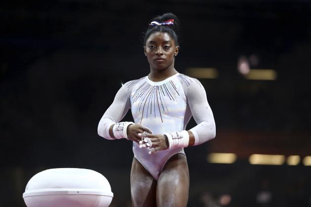 Simone Biles of the United States gets ready to perform on the uneven bars in the women's all-around final at the Gymnastics World Championships in Stuttgart, Germany, Thursday, Oct. 10, 2019. (AP Photo/Matthias Schrader)