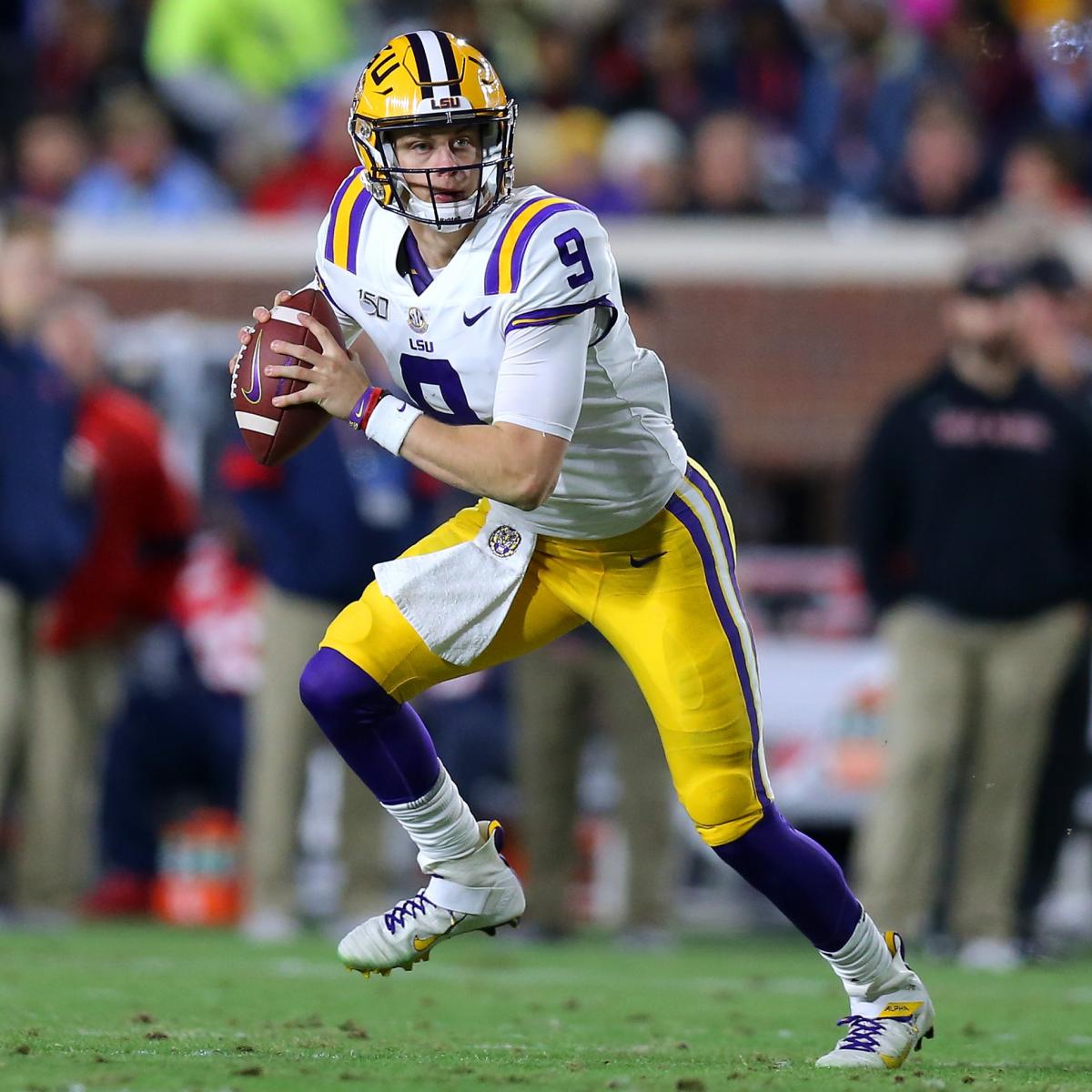 Joe Burrow LSU Tigers Unsigned White Jersey Throwing Photograph