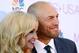 Randy Couture and Mindy Robinson pose during a red carpet event before the Miss USA 2014 pageant in Baton Rouge, La., Sunday, June 8, 2014. (AP Photo/Jonathan Bachman)