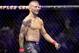 T.J. Dillashaw smiles after his win against Cody Garbrandt during their UFC title bantamweight mixed martial arts bout at UFC 227 in Los Angeles, Saturday, Aug. 4, 2018. (AP Photo/Chris Carlson)