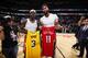 NEW ORLEANS, LA - NOVEMBER 27: Anthony Davis #3 of the Los Angeles Lakers and Jrue Holiday #11 of the New Orleans Pelicans exchange jerseys after a game on November 27, 2019 at Smoothie King Center in New Orleans, Louisiana. NOTE TO USER: User expressly acknowledges and agrees that, by downloading and or using this photograph, User is consenting to the terms and conditions of the Getty Images License Agreement. Mandatory Copyright Notice: Copyright 2019 NBAE (Photo by Jeff Haynes/NBAE via Getty Images)