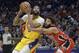 Los Angeles Lakers forward Anthony Davis (3) moves around New Orleans Pelicans guard Kenrich Williams (34) during the first half of an NBA basketball game in New Orleans, Wednesday, Nov. 27, 2019. (AP Photo/Matthew Hinton)