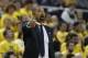 Michigan Wolverines head coach Juwan Howard signals from the sidelines during the first half of an NCAA college basketball game against Elon, Friday, Nov. 15, 2019, in Ann Arbor, Mich. (AP Photo/Carlos Osorio)