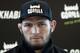 UFC lightweight champion Khabib Nurmagomedov attends a media conference in Moscow, Russia, Monday, Nov. 26, 2018. The Russian professional mixed martial arts fighter Nurmagomedov, said he can imagine a reconciliation with Conor McGregor after the bitter feud around last month's title fight, but said he would like to fight Floyd Mayweather Jr. (AP Photo/Pavel Golovkin)