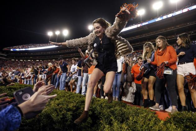 Auburn fans jump onto the field after they defeated Alabama 48-45 in an NCAA college football game Saturday, Nov. 30, 2019, in Auburn, Ala. (AP Photo/Butch Dill)